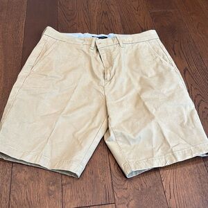 Tommy Hilfiger. Men’s, dark khaki shorts. Last photo shows more of true color.